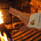 Hands warming by a fire, with bronze sculptural cufflinks